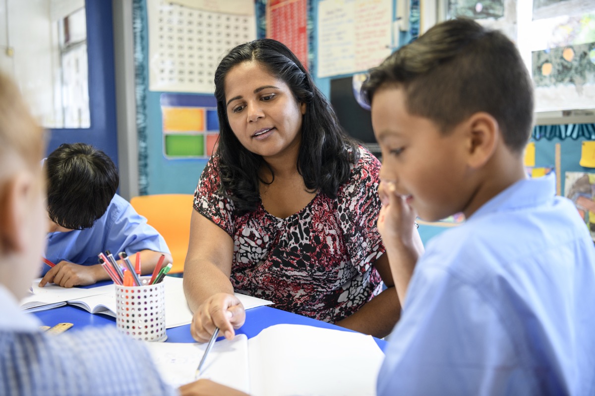Teacher helping a student
